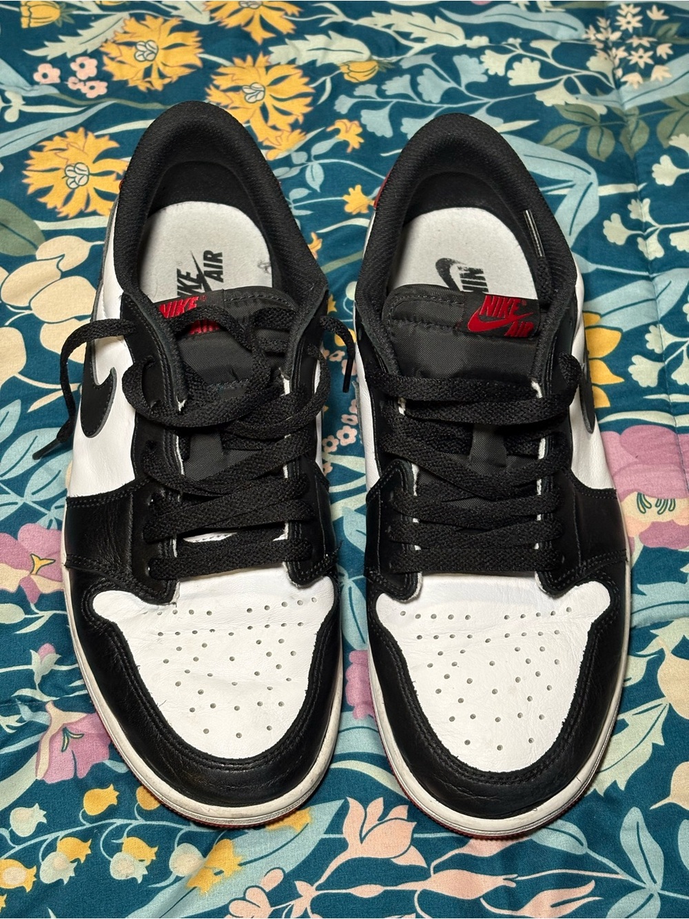 Jordan 1 Low Black and White Sneakers with Red Logo Accent
